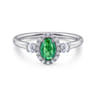14K White Gold Oval Emerald and Diamond Halo Three Stone Ring - 0.25 ct