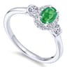 14K White Gold Oval Emerald and Diamond Halo Three Stone Ring - 0.25 ct