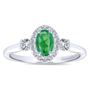 14K White Gold Oval Emerald and Diamond Halo Three Stone Ring