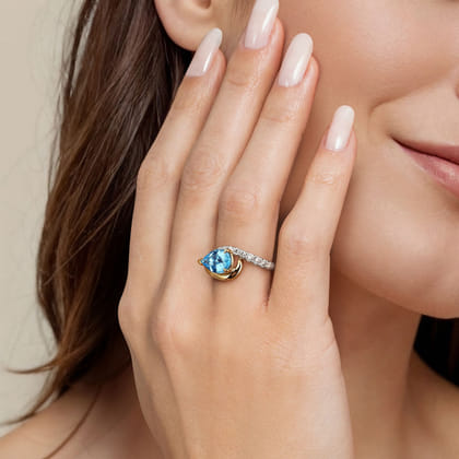 14K White and Yellow Gold Diamond and Pear Blue Topaz Bypass Ladies Ring