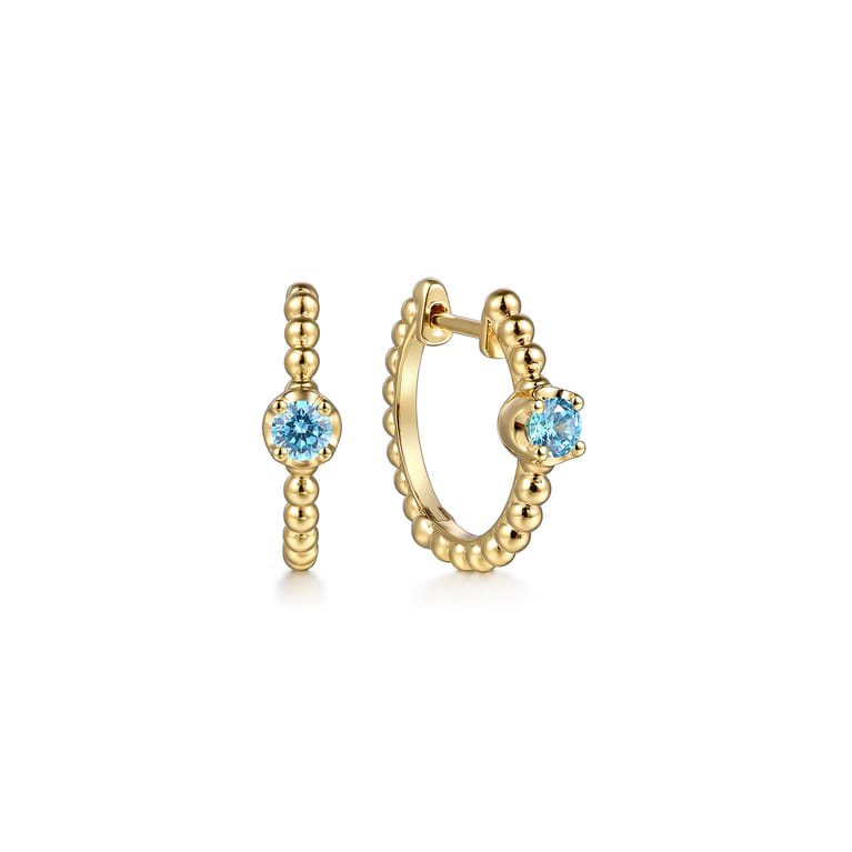 14K Yellow Gold Bujukan Blue Topaz 15mm Huggie Earrings - Shot 1