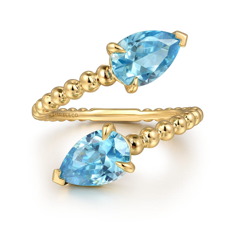 14K Yellow Gold Bujukan Blue Topaz Bypass Ladies Ring - Shot 1