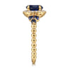 14K Yellow Gold Bujukan Diamond Halo and Oval Blue Sapphire Fashion Ring - 0.1 ct