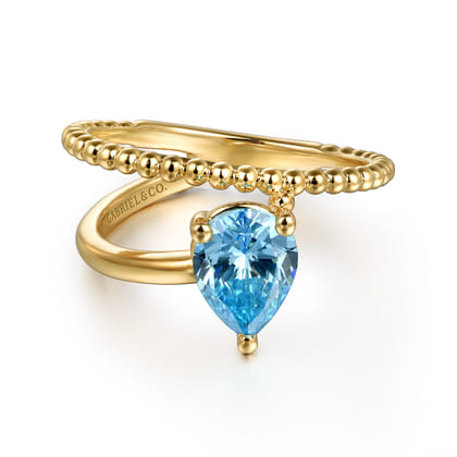 14K Yellow Gold Bujukan and Blue Topaz Bypass Ring