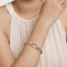 14K Yellow Gold Bujukan and Diamond Interlocking Oval Split Bangle Bracelet - 0.25 ct