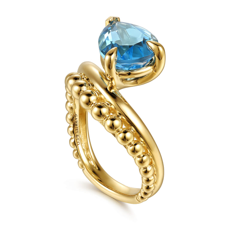 14K Yellow Gold Graduating Bujukan Pear Blue Topaz Curved Ring - Shot 3
