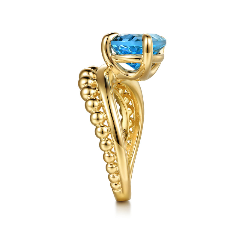 14K Yellow Gold Graduating Bujukan Pear Blue Topaz Curved Ring - Shot 4