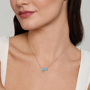 14K Yellow Gold Toi et Moi Blue Topaz and Diamond Halo Necklace
