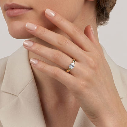 Bara - 14K Yellow Gold Half Bezel East West Oval Diamond Engagement Ring