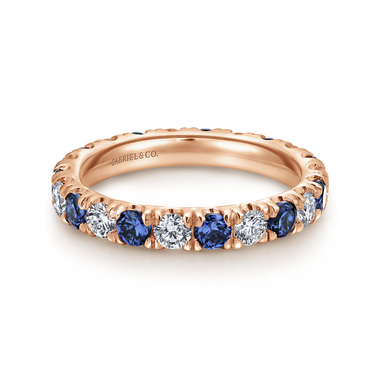 Eternity Band Wedding Ring in 14k Rose Gold with Round Sapphire at Gabriel & Co. - Shot 1
