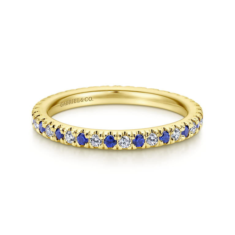 Eternity Band Wedding Ring in 14k Yellow Gold with Round Sapphire at Gabriel & Co. - Shot 1