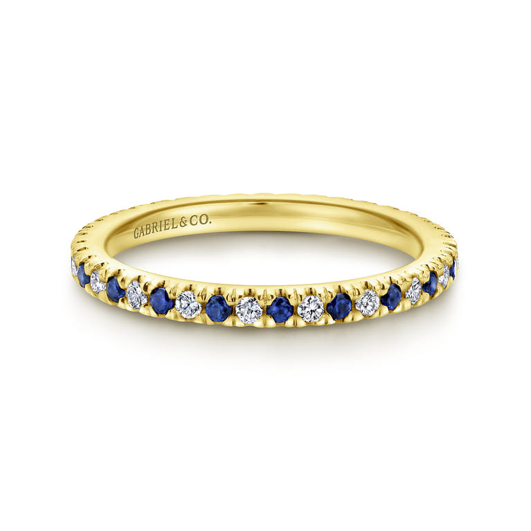 Eternity Band Wedding Ring in 14k Yellow Gold with Round Sapphire at Gabriel & Co. - Shot 1