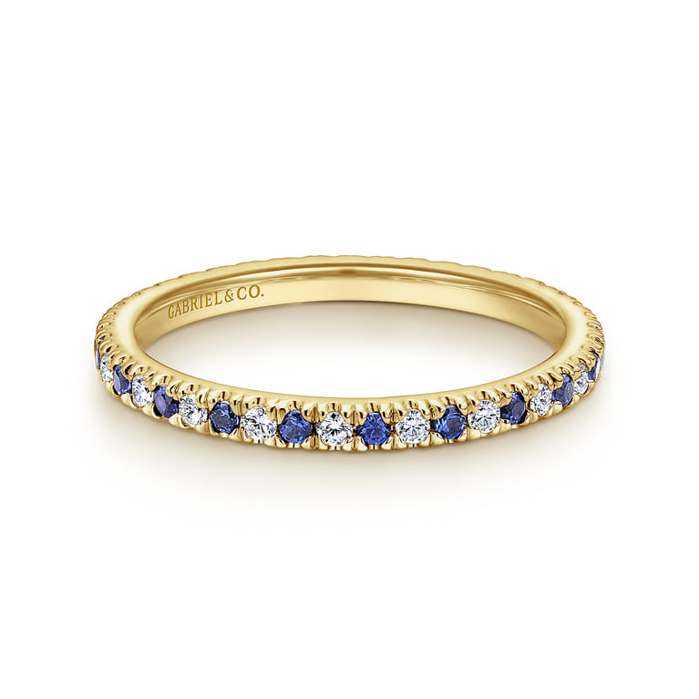 Eternity Band Wedding Ring in 14k Yellow Gold with Round Sapphire at Gabriel & Co. - Shot 1