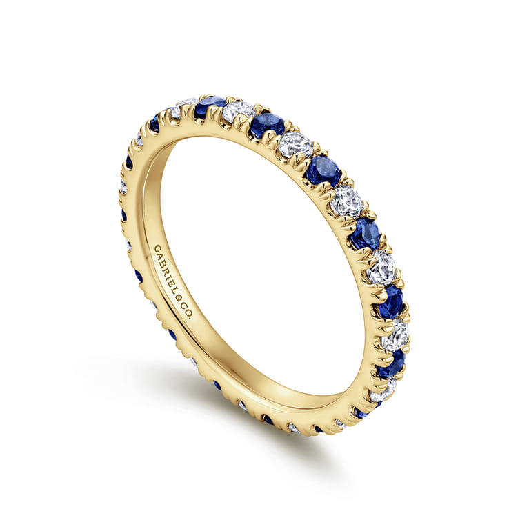 Eternity Band Wedding Ring in 14k Yellow Gold with Round Sapphire at Gabriel & Co. - Shot 3