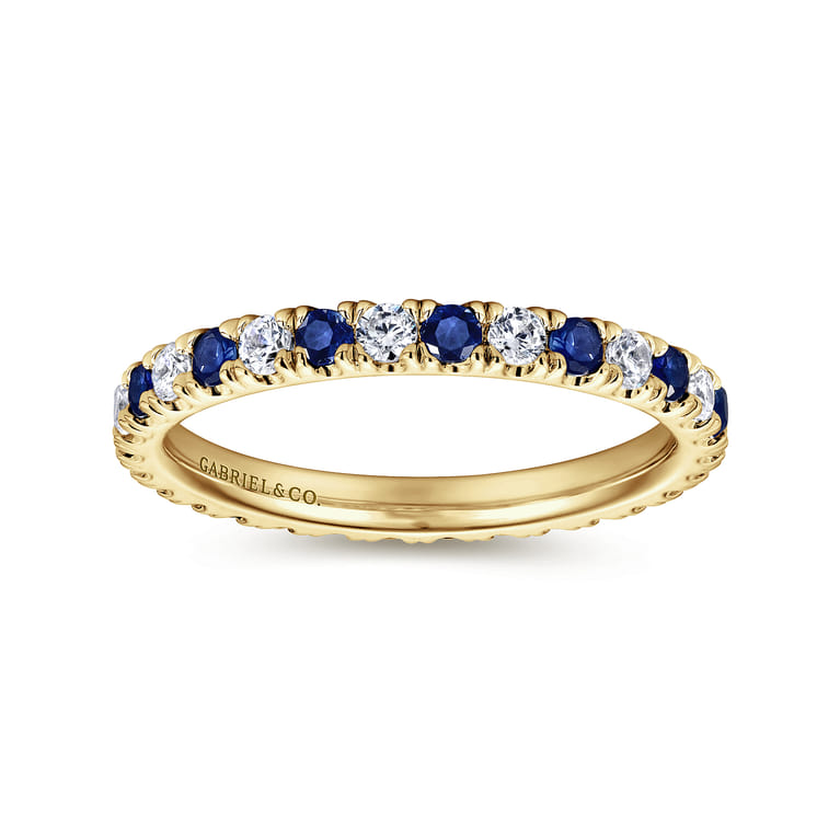 Eternity Band Wedding Ring in 14k Yellow Gold with Round Sapphire at Gabriel & Co. - Shot 4