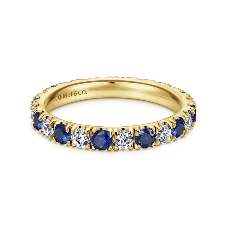 Eternity Band Wedding Ring in 14k Yellow Gold with Round Sapphire at Gabriel & Co. - Shot 1