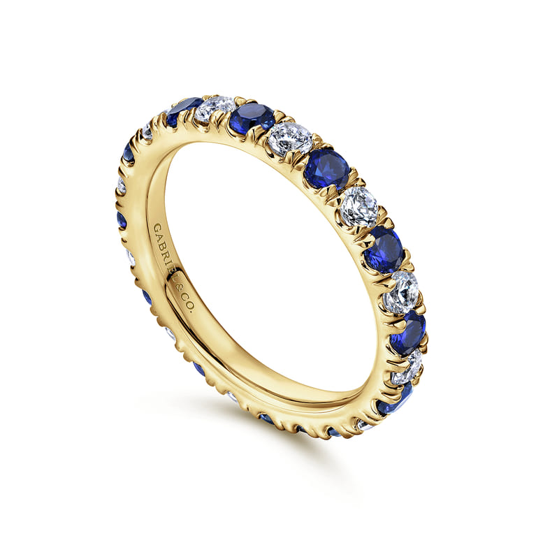 Eternity Band Wedding Ring in 14k Yellow Gold with Round Sapphire at Gabriel & Co. - Shot 3