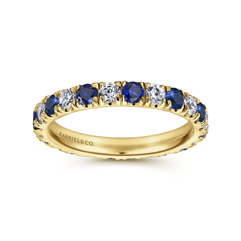 Eternity Band Wedding Ring in 14k Yellow Gold with Round Sapphire at Gabriel & Co. - Shot 4