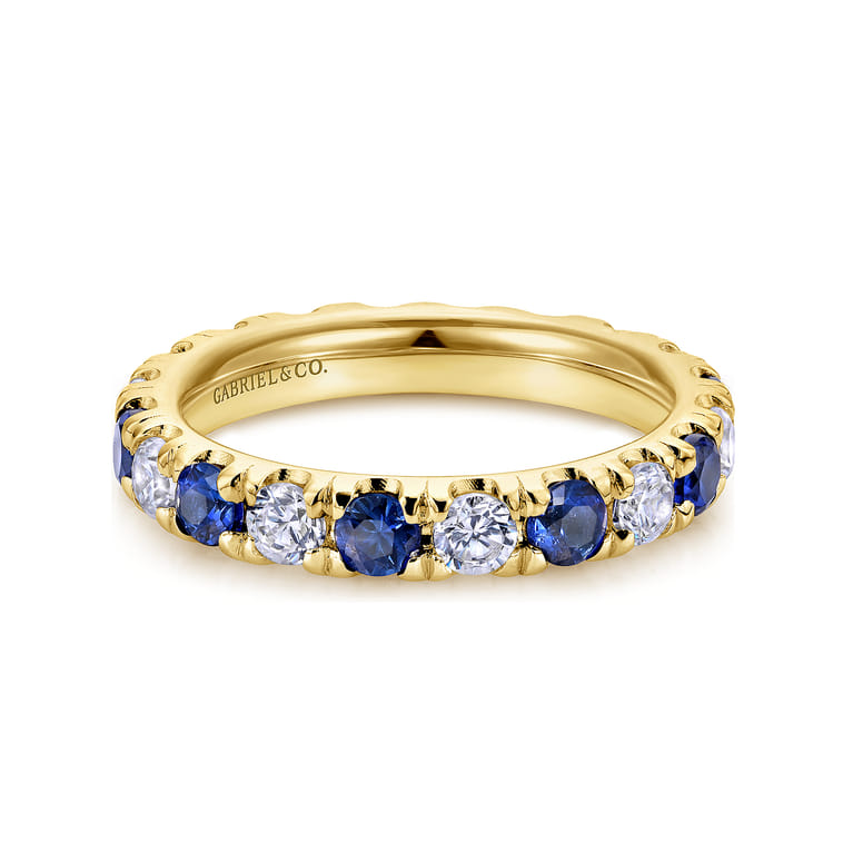 Eternity Band Wedding Ring in 14k Yellow Gold with Round Sapphire at Gabriel & Co. - Shot 1
