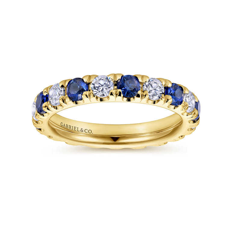 Eternity Band Wedding Ring in 14k Yellow Gold with Round Sapphire at Gabriel & Co. - Shot 4