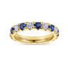 Eternity Band Wedding Ring in 14k Yellow Gold with Round Sapphire at Gabriel & Co.