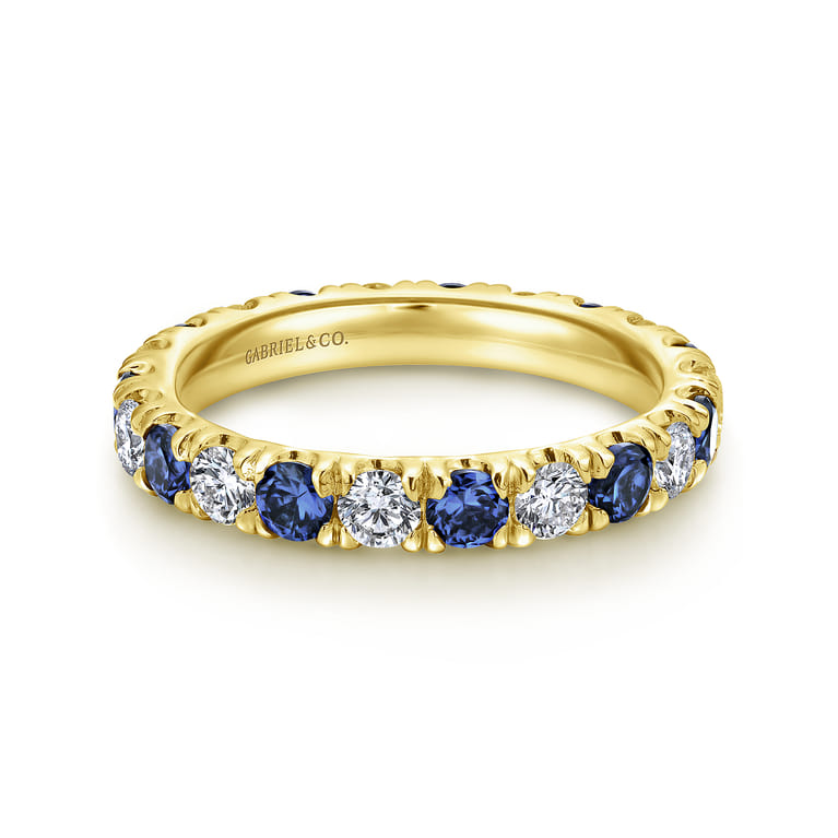 Eternity Band Wedding Ring in 14k Yellow Gold with Round Sapphire at Gabriel & Co. - Shot 1