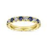 Eternity Band Wedding Ring in 14k Yellow Gold with Round Sapphire at Gabriel & Co.