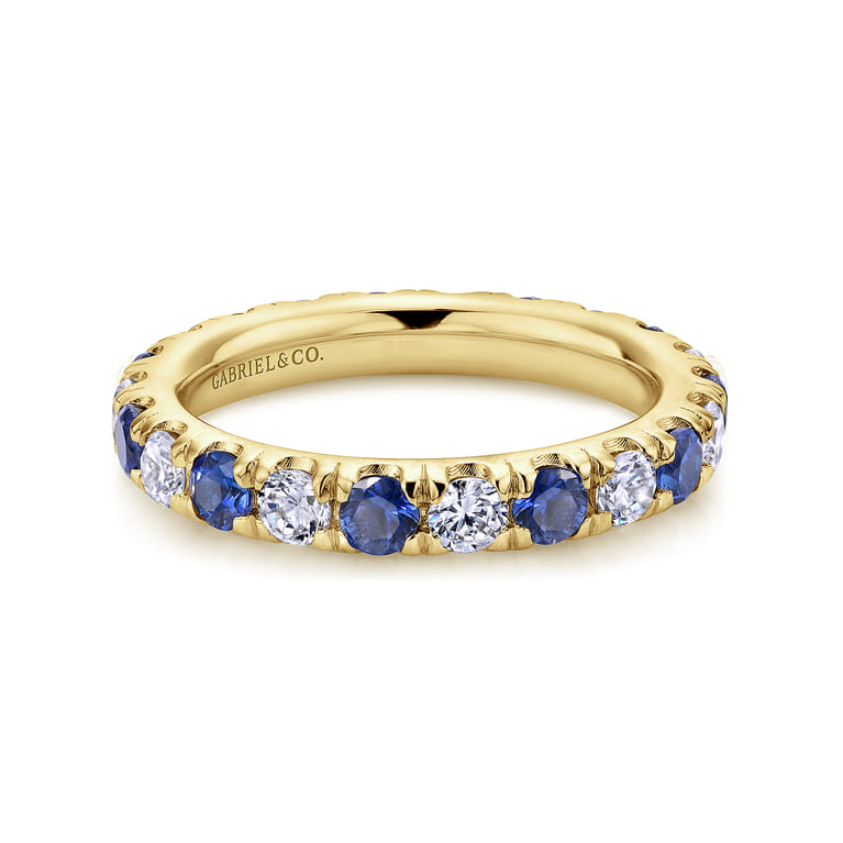 Eternity Band Wedding Ring in 14k Yellow Gold with Round Sapphire at Gabriel & Co. - Shot 1