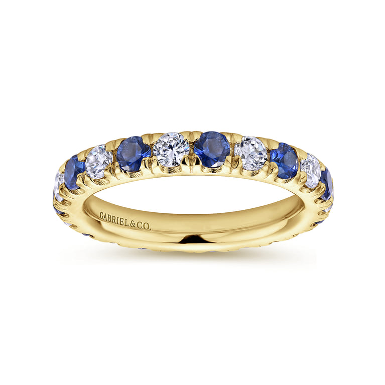 Eternity Band Wedding Ring in 14k Yellow Gold with Round Sapphire at Gabriel & Co. - Shot 4