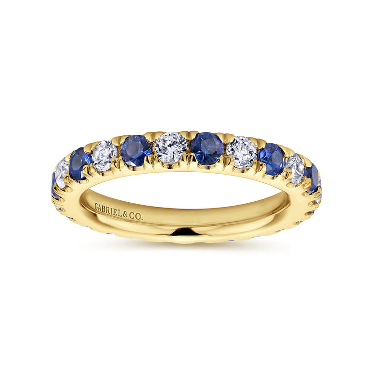Eternity Band Wedding Ring in 14k Yellow Gold with Round Sapphire at Gabriel & Co. - Shot 4