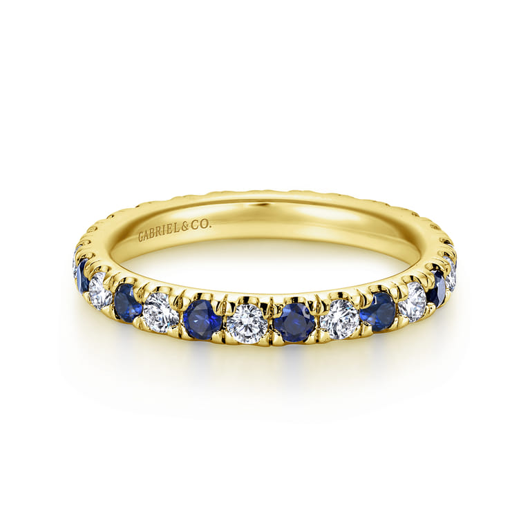 Eternity Band Wedding Ring in 14k Yellow Gold with Round Sapphire at Gabriel & Co. - Shot 1