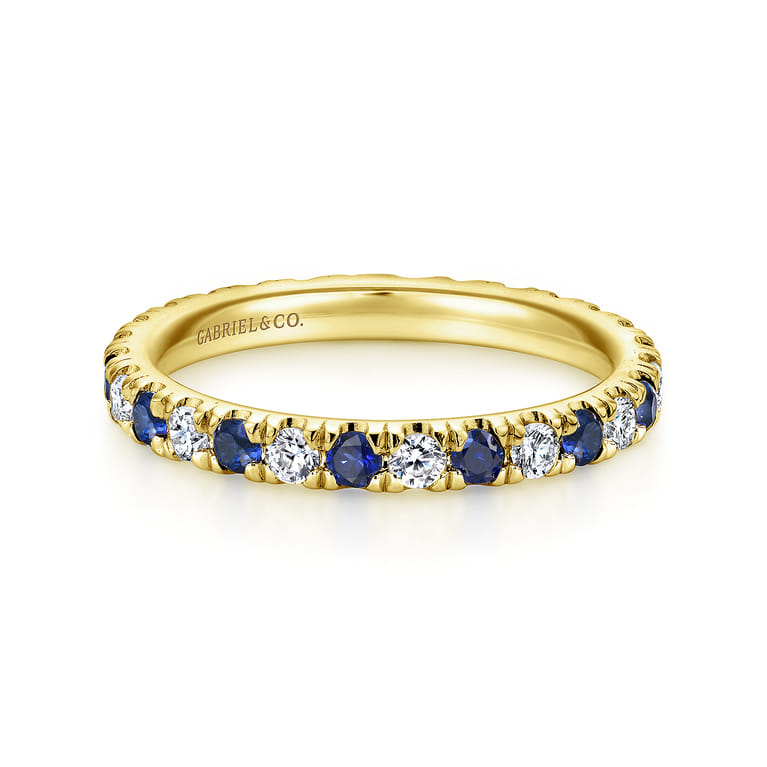 Eternity Band Wedding Ring in 14k Yellow Gold with Round Sapphire at Gabriel & Co. - Shot 1