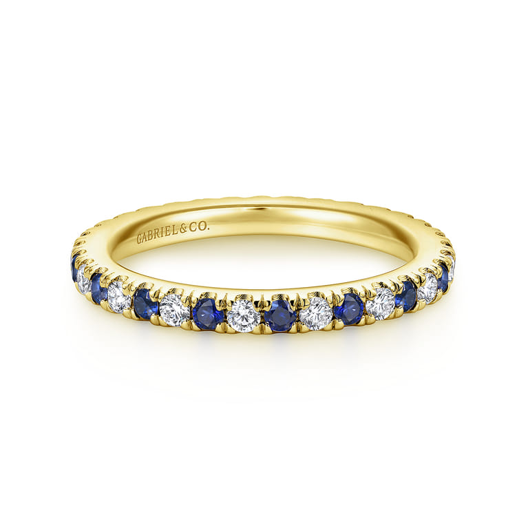 Eternity Band Wedding Ring in 14k Yellow Gold with Round Sapphire at Gabriel & Co. - Shot 1