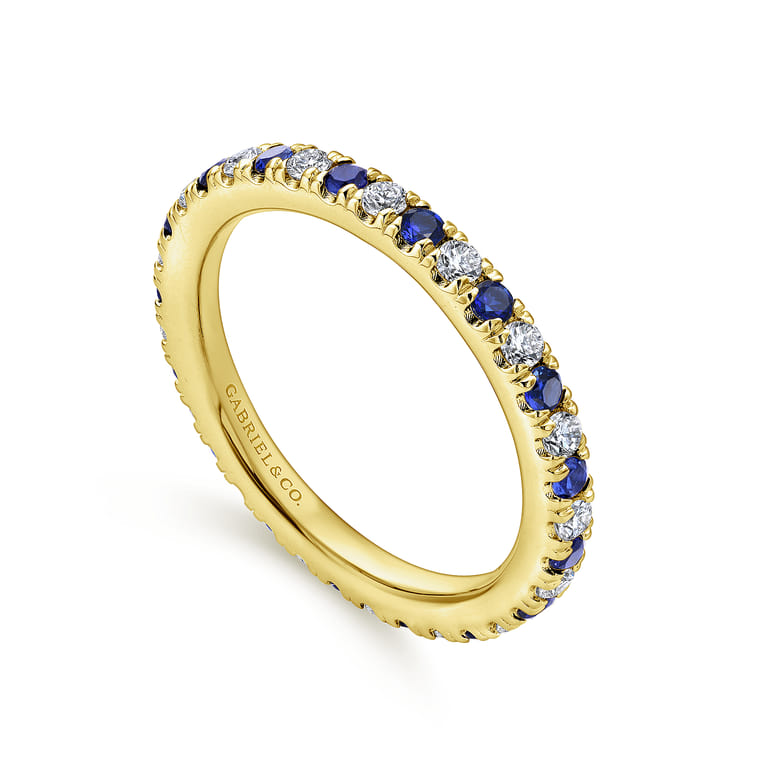 Eternity Band Wedding Ring in 14k Yellow Gold with Round Sapphire at Gabriel & Co. - Shot 3