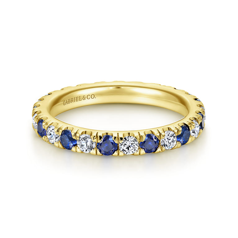 Eternity Band Wedding Ring in 14k Yellow Gold with Round Sapphire at Gabriel & Co. - Shot 1