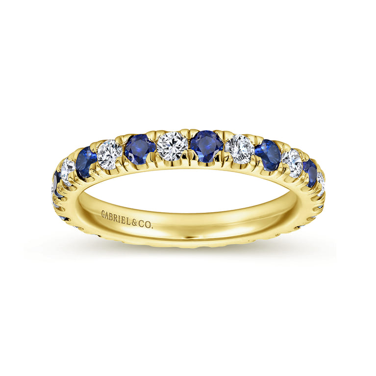 Eternity Band Wedding Ring in 14k Yellow Gold with Round Sapphire at Gabriel & Co. - Shot 4