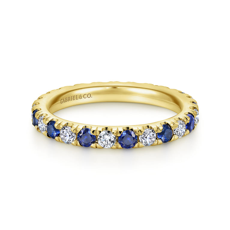 Eternity Band Wedding Ring in 14k Yellow Gold with Round Sapphire at Gabriel & Co. - Shot 1