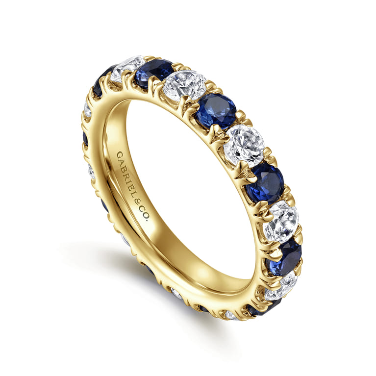Eternity Band Wedding Ring in 14k Yellow Gold with Round Sapphire at Gabriel & Co. - Shot 3