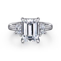 An iconic 3 stone engagement ring that celebrates the past, present, and future of your unique romance. This shining 18K white gold setting is engineered to highlight your 3ct emerald center stone. Trapezoid side stones offer an additional 0.47cts of sparkle.