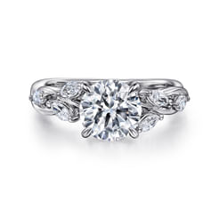Marquise diamonds are stationed along the band of this graceful split shank engagement ring. The brilliant 0.33ct stones are reminiscent of pretty petals along a twisted 14K white gold vine. Fresh and floral, this setting simply awaits your 1.5ct round center stone.