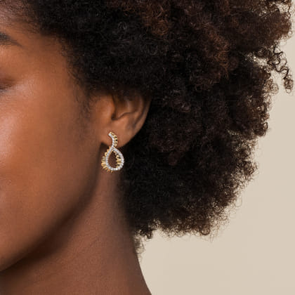 Diamond Cut - 14K Yellow Gold Diamond Earrings Stud in Swirl Shape With Diamond Cut Texture