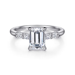 A masterpiece that transcends conventional elegance, this 14K white gold engagement ring beholds a captivating 1.5 ct emerald-cut diamond takes center stage, flanked by two exquisite baguettes on each side, artfully embraced by a bar setting along the shank. This 5-stone style engagement ring beholds 0.26 ct diamonds, a wearable ode to enduring love.