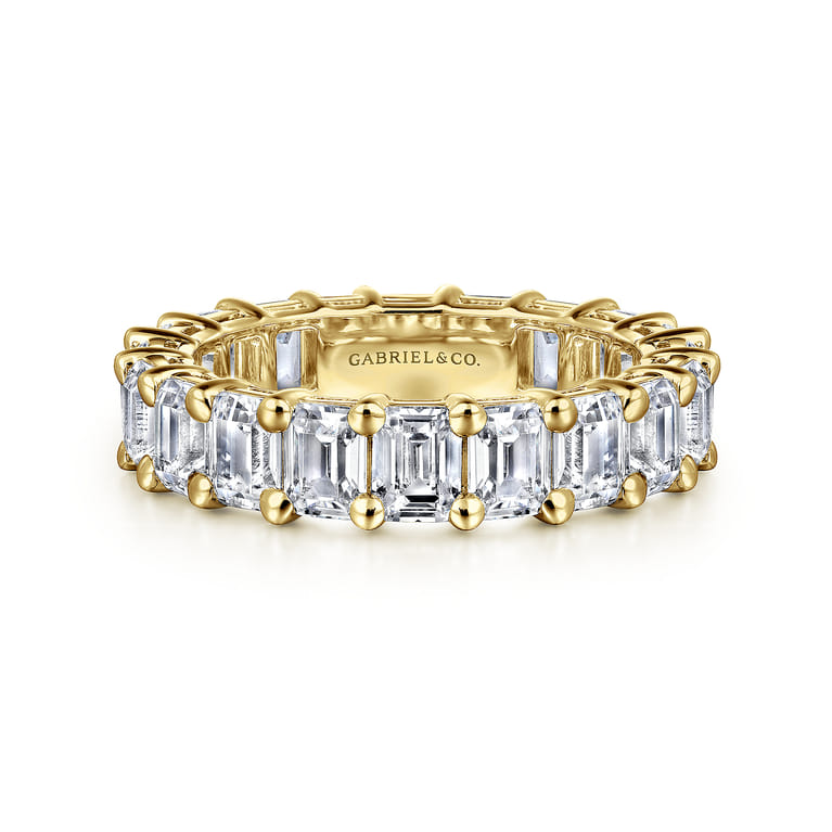 Eternity Band Wedding Ring in 14k Yellow Gold with Emerald Cut Natural Diamond at Gabriel & Co. - Shot 1