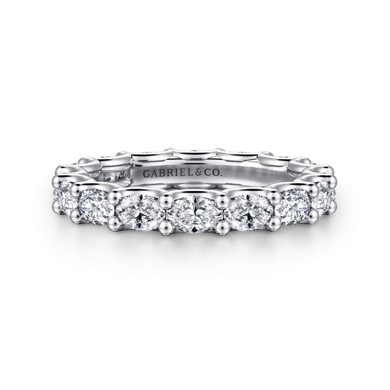 Eternity Band Wedding Ring in 14k White Gold with Oval Natural Diamond at Gabriel & Co. - Shot 1