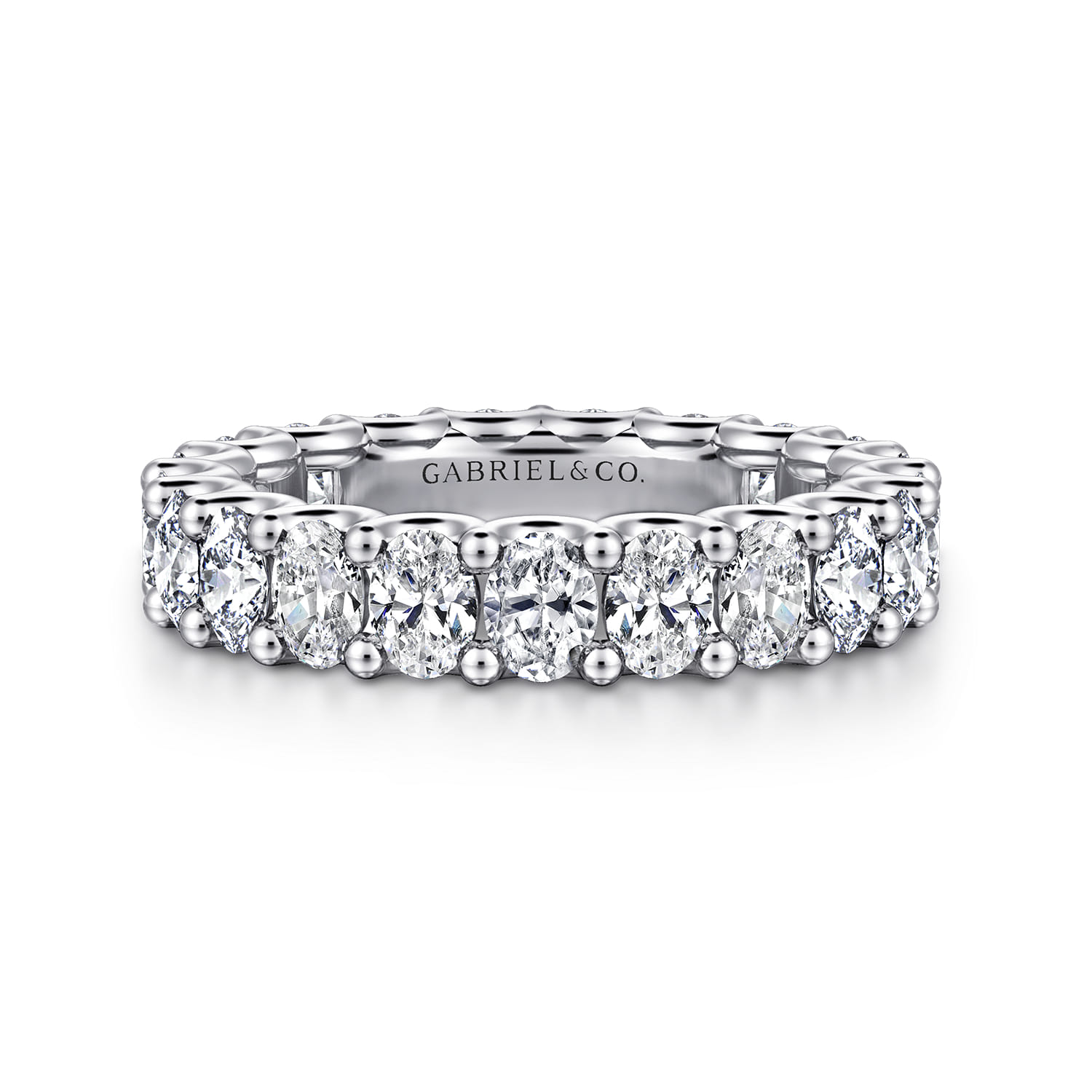 Eternity Band Wedding Ring in 14k White Gold with Oval Natural Diamond at Gabriel & Co. - Shot 1