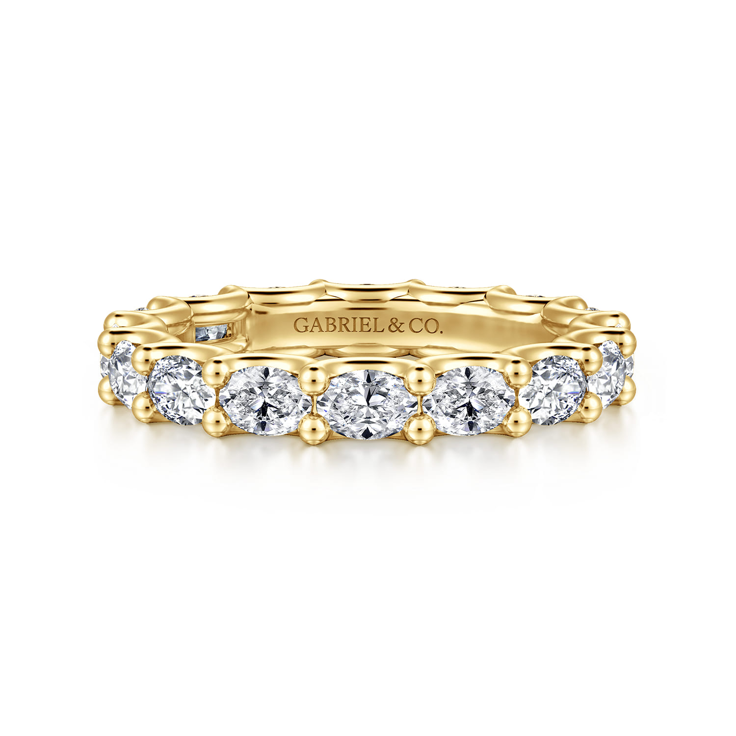 Eternity Band Wedding Ring in 14k Yellow Gold with Oval Natural Diamond at Gabriel & Co. - Shot 1