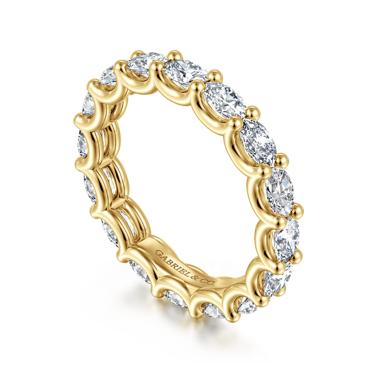Eternity Band Wedding Ring in 14k Yellow Gold with Oval Natural Diamond at Gabriel & Co. - Shot 3
