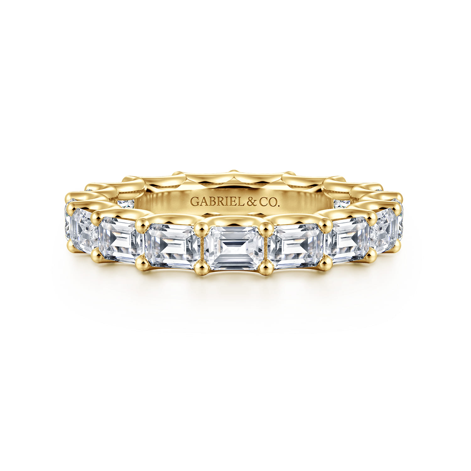 Eternity Band Wedding Ring in 14k Yellow Gold with Emerald Cut Natural Diamond at Gabriel & Co. - Shot 1