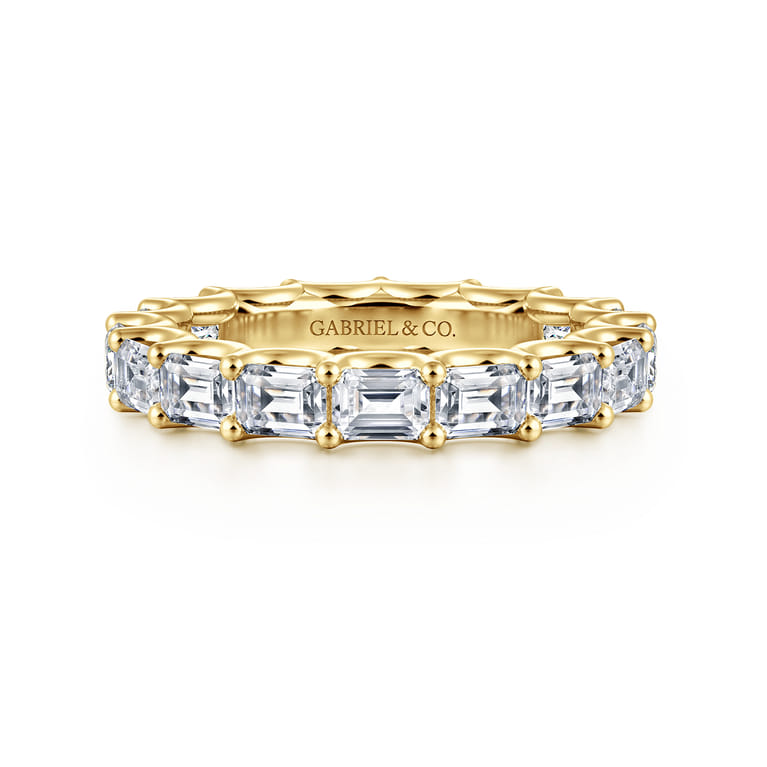 Eternity Band Wedding Ring in 14k Yellow Gold with Emerald Cut Natural Diamond at Gabriel & Co. - Shot 1
