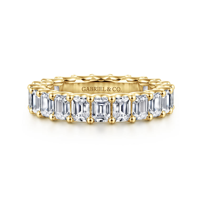 Eternity Band Wedding Ring in 14k Yellow Gold with Emerald Cut Natural Diamond at Gabriel & Co. - Shot 1